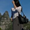 6930e2316e68136f4d9b2419 New Balenciaga Winter 24 Collection Re-See Shoulder Bucket Bag, Top-Grain Leather, Minimalist Luxury Design, Upcycled Motorbike Glove Handbag with Keychain Closure, Effortless Chic Style