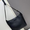 6930e2366e68136f4d9b2420 New Balenciaga Winter 24 Collection Re-see Handbag, Shoulder Bucket Bag in Full-Grain Leather, Minimalist Luxury Design Upcycled from Motorcycle Gloves with Keychain Closure, Effortlessly Chic Oversized Look