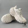 6930e8b96e68136f4d9b2ece BALENCIAGA Defender Silver Tire Dad Sneakers Unisex