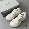 6930e8ba6e68136f4d9b2ed2 BALENCIAGA Defender Silver Tire Dad Sneakers Unisex