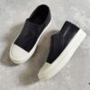 6930f01c6e68136f4d9b395e Rick Owens Style Slip-on Leather Sneakers with Oversized Frame