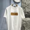 6930fb136e68136f4d9b4643 Louis Vuitton Short Sleeve T-Shirt with Leather Patch Signature Detail