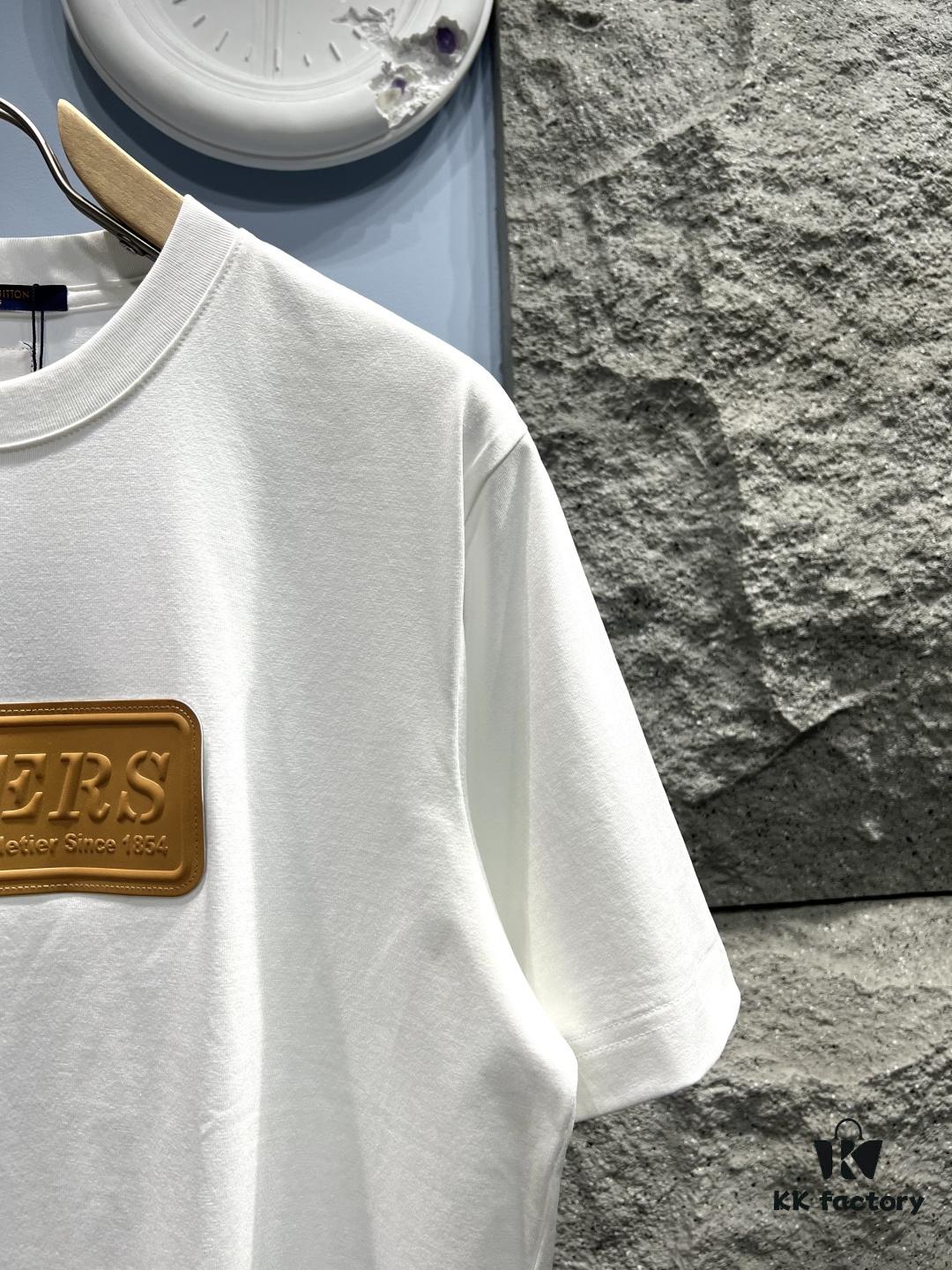 6930fb176e68136f4d9b4645 Louis Vuitton Short Sleeve T-Shirt with Leather Patch Signature Detail