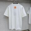 6930fb7c6e68136f4d9b46ad LV Louis Vuitton Embossed Leather Patch Knitted Short-Sleeve T-Shirt