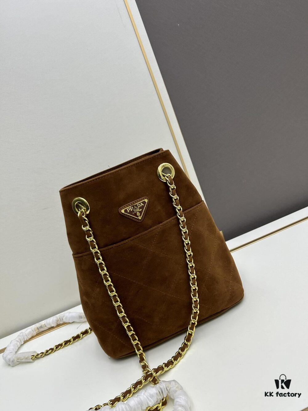 693109ee908475d562cd8e2d Vintage Prada Suede Crossbody Bag with Chain – A Timeless 'Baozi' Design