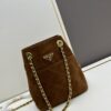 693109ee908475d562cd8e2d Vintage Prada Suede Crossbody Bag with Chain – A Timeless 'Baozi' Design