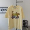 69311c78908475d562cd921e New GUCCI 2024 Leopard Print Letter Short Sleeve T-Shirt in Beige, Paw Design, Unisex Couples Style