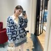 69312b18908475d562cd9618 GUCCI Wool-Blend Knit Polo Collar Cardigan with Double G Logo Unisex