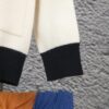 69312d17908475d562cd96b5 GUCCI Color-Block Button Knit Coat Made of High-End Wool Material