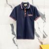693130f0908475d562cd97cf GUCCI Men's Polo Shirt with Lapel, Embroidered Logo, Color-Block Striped Pocket Design