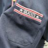 6931310d908475d562cd97d6 GUCCI Men's Polo Shirt with Lapel, Embroidered Logo, Color-Block Striped Pocket Design