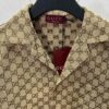 69313ef9908475d562cd9b8f Gucci 25SS New Arrival Letter Interlocking Pattern Shirt Inspired by Founder Guccio Gucci's Name, Crafted in GG Canvas with Side Slits