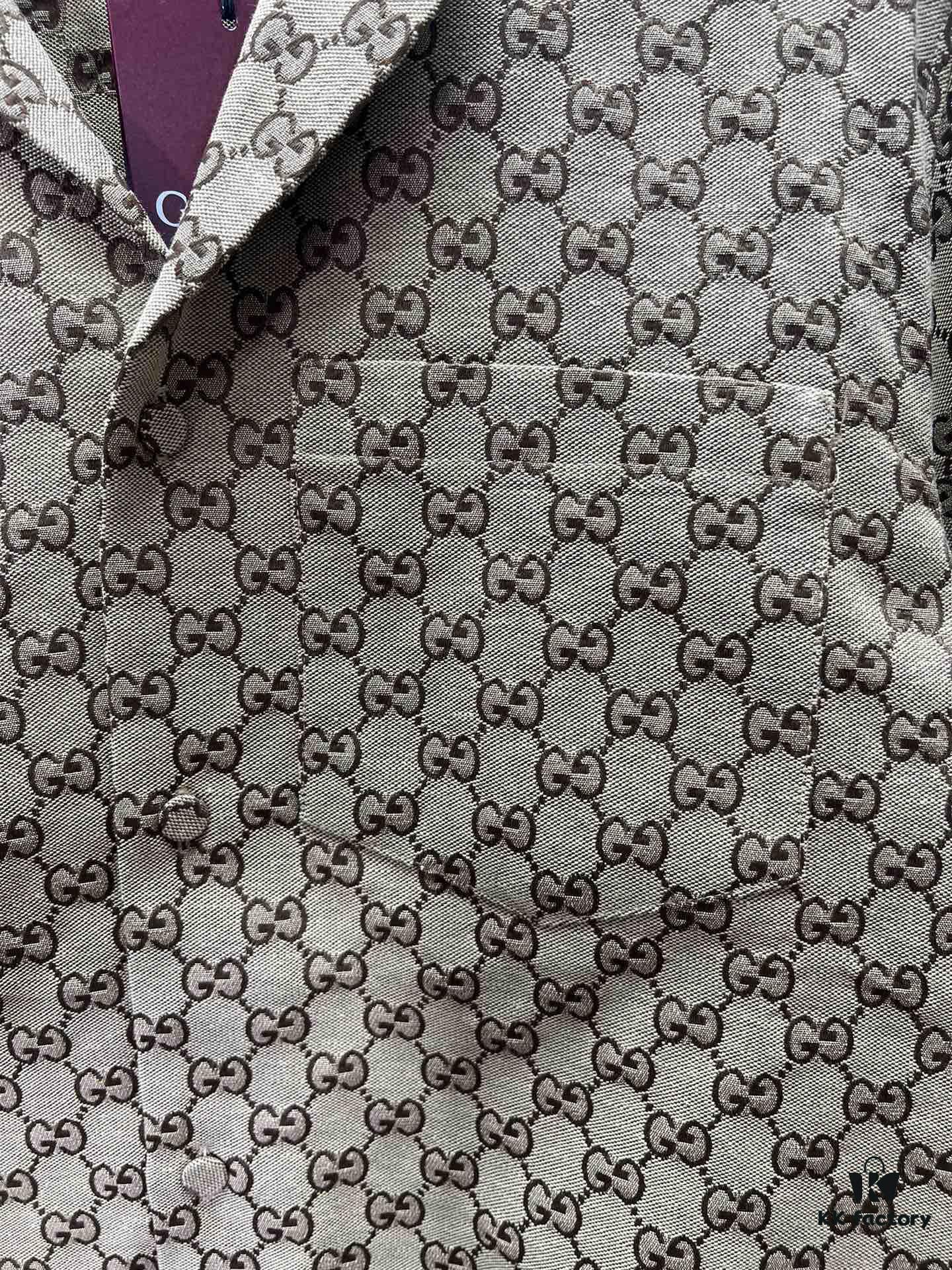 69313f10908475d562cd9b93 Gucci 25SS New Arrival Letter Interlocking Pattern Shirt Inspired by Founder Guccio Gucci's Name, Crafted in GG Canvas with Side Slits