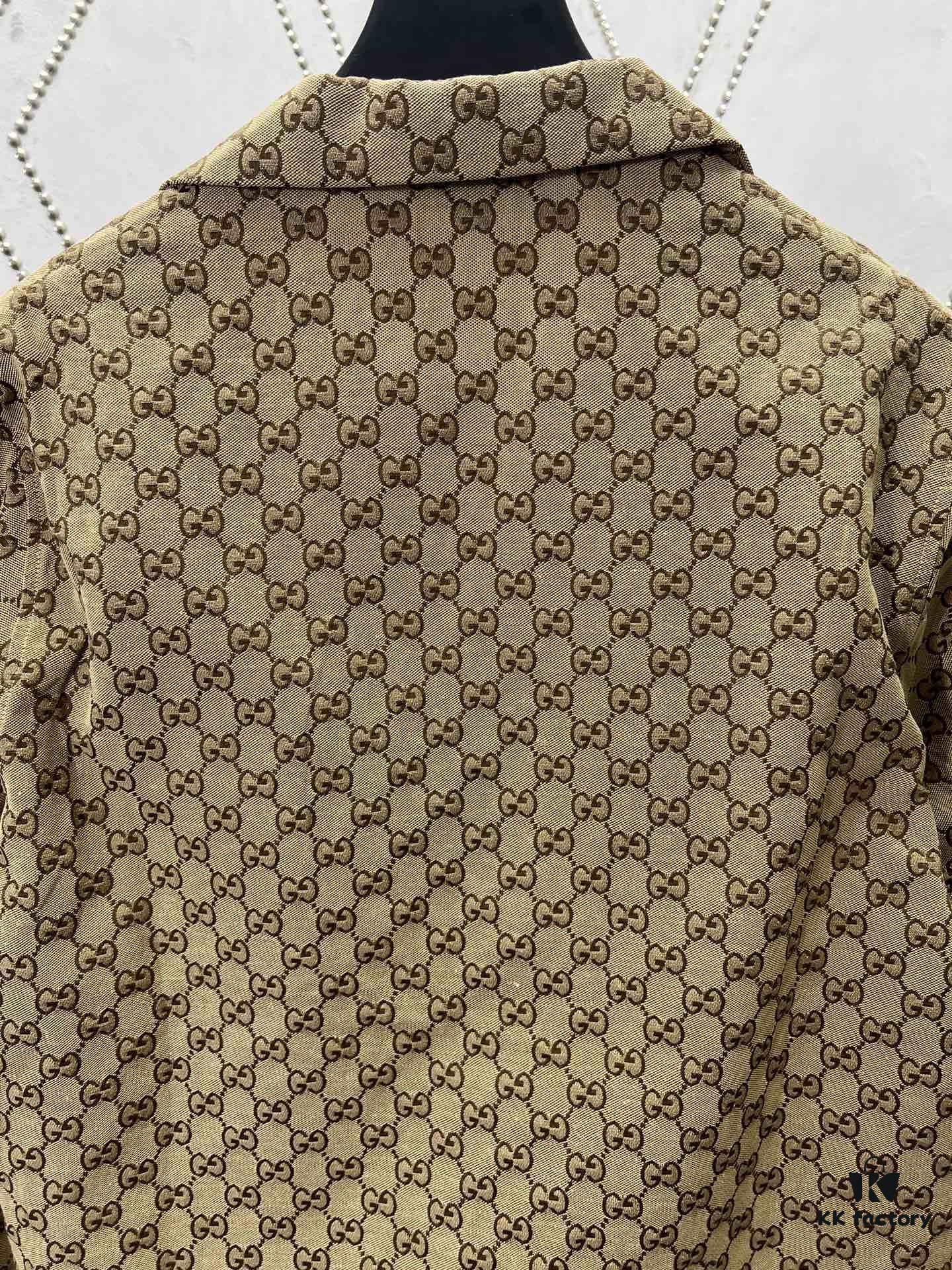69313f1a908475d562cd9b96 Gucci 25SS New Arrival Letter Interlocking Pattern Shirt Inspired by Founder Guccio Gucci's Name, Crafted in GG Canvas with Side Slits