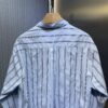 6931a050ccd8ab3d7af94124 DR🔥Dior Men's Collection Fashion Show Debut, Stylishly Tailored Blue Striped Cotton Workwear-Inspired Oversized Jacket with Christian Couture Embroidery, Unisex Design