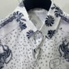 6931a057ccd8ab3d7af941b7 Dior 25SS New Arrival Shirt from the DIOR AND HYLTON NEL Collaboration Collection, Interpreting the Artist's Artistic Vision. Crafted from White Mulberry Silk Twill, Featuring an Oversized Silhouette and Concealed Button Closure. Stylish Design Perfectly Matches Other Pieces from This Limited Series