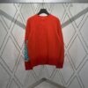 6931a058ccd8ab3d7af941dd DIOR 25SS New Arrival Knitwear from the DIOR AND KAWS Limited Collection. Crafted from red and burgundy wool knit fabric, one sleeve features the DIOR AND KAWS signature embroidery, reinterpreting the Dior logo with a vibrant serpentine motif. The hem and cuffs feature contrasting details, perfect for pairing with classic jeans or shorts to create a striking look.