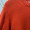 6931a058ccd8ab3d7af941e0 DIOR 25SS New Arrival Knitwear from the DIOR AND KAWS Limited Collection. Crafted from red and burgundy wool knit fabric, one sleeve features the DIOR AND KAWS signature embroidery, reinterpreting the Dior logo with a vibrant serpentine motif. The hem and cuffs feature contrasting details, perfect for pairing with classic jeans or shorts to create a striking look.