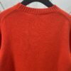 6931a059ccd8ab3d7af941e3 DIOR 25SS New Arrival Knitwear from the DIOR AND KAWS Limited Collection. Crafted from red and burgundy wool knit fabric, one sleeve features the DIOR AND KAWS signature embroidery, reinterpreting the Dior logo with a vibrant serpentine motif. The hem and cuffs feature contrasting details, perfect for pairing with classic jeans or shorts to create a striking look.