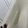 6931a059ccd8ab3d7af941e9 Dior 25SS New Arrival Knitwear from the DIOR AND KAWS Limited Edition Collection. Crafted from white and yellow wool knit fabric, one sleeve features the DIOR AND KAWS signature embroidery, reinterpreting the Dior logo with a colorful serpentine design. The hem and cuffs are finished with contrasting details, perfect for pairing with classic jeans or shorts to create a striking look.