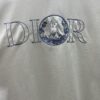 6931a05cccd8ab3d7af94225 Dior 25ss New Arrival T-Shirt Featuring Signature Motif from the Dior and Hylton Nel Collaboration Collection This Season. Crafted from Premium White Cotton Jersey, This Classic Silhouette Boasts a Ribbed Round Neckline and Embroidered Detailing on the Chest for Elevated Style. Designed with a Relaxed Fit, Perfectly Paired with Sweatpants or Jeans.