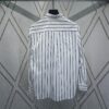 6931a062ccd8ab3d7af942ab Dior 24SS New Arrival Shirt Featured in Dior's Winter 2024 Men's Collection Show, Fashionably Tailored to Highlight Workwear Aesthetics, Crafted from Blue Striped Cotton Fabric with a Christian Dior Couture Embroidered Chest Pocket, Oversized Fit for a Casual Style