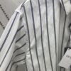 6931a062ccd8ab3d7af942ad Dior 24SS New Arrival Shirt Featured in Dior's Winter 2024 Men's Collection Show, Fashionably Tailored to Highlight Workwear Aesthetics, Crafted from Blue Striped Cotton Fabric with a Christian Dior Couture Embroidered Chest Pocket, Oversized Fit for a Casual Style
