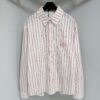 6931a08eccd8ab3d7af94600 Dior 25ss New Arrival Shirt Combines Modern Elegance with Traditional Aesthetics. Crafted from White Cotton Poplin, Featuring Pink Stripe Pattern and the 'Dior For My Real Friends' Logo from the DIOR AND HYLTON NEL Collaboration Series. Includes a Patch Pocket on the Chest and Hidden Button Closure for a Refined Look. Ideal for Everyday Wear.