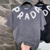 6931a11eccd8ab3d7af95079 25ss PRADA Hand-Painted Logo T-Shirt Inspired by 80s Retro Style