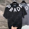 6931a11eccd8ab3d7af9507a 25ss PRADA Hand-Painted Logo T-Shirt Inspired by 80s Retro Style