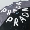 6931a11eccd8ab3d7af9507b 25ss PRADA Hand-Painted Logo T-Shirt Inspired by 80s Retro Style