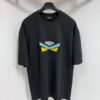 6931a145ccd8ab3d7af95361 FENDI Round-Neck Short-Sleeve T-Shirt with Eye Print, Pure Cotton Fabric Featuring Gold Snake-Eye Design and Lettering Logo, Mother-of-Pearl Buttons