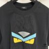 6931a146ccd8ab3d7af95364 FENDI Round-Neck Short-Sleeve T-Shirt with Eye Print, Pure Cotton Fabric Featuring Gold Snake-Eye Design and Lettering Logo, Mother-of-Pearl Buttons