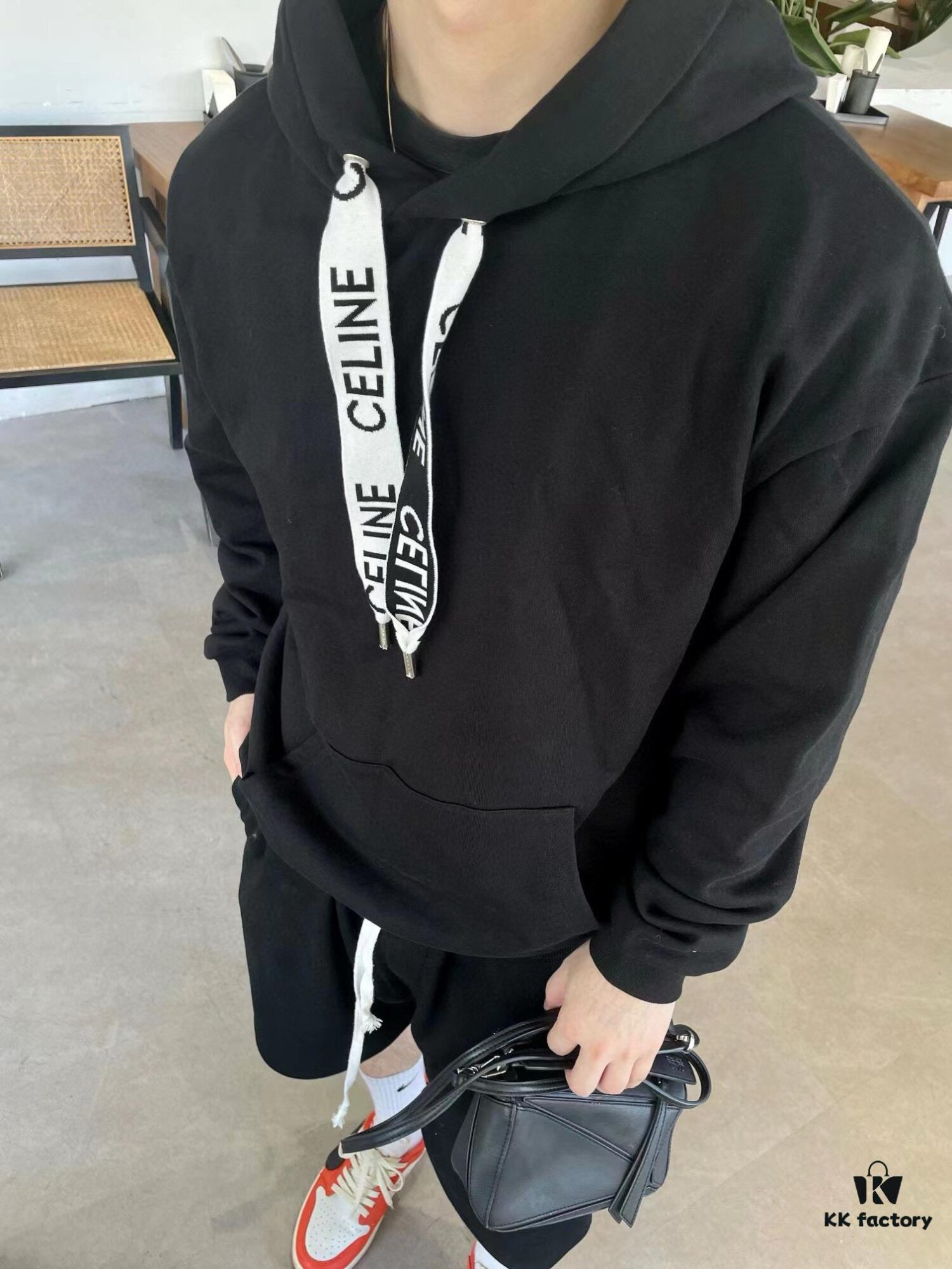 6931a19accd8ab3d7af95a0c CELINE Letter Tape Drawstring Hoodie