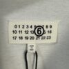 6931a1ebccd8ab3d7af95fe0 High-End Maison Margiela 2024 Triangle Logo Numeric Graphic T-Shirt