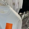 6931a28eccd8ab3d7af96a3d Hermes 2025 Spring Collection Short Sleeve Shirt, Hand-Customized Logo at Chest, Pure Cotton Fabric with Gold Thread Embroidery, Classic Buttoned Hem, OS Drop-Shoulder Fit