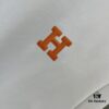 6931a28eccd8ab3d7af96a47 Hermes 2025 Spring-Summer New Short Sleeve T-Shirt with Hand-Customized Logo on Chest, Pure Cotton Fabric with Gold Thread Embroidery, Classic Buttoned Hem and OS Drop-Shoulder Fit