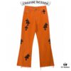 6931a3c9ccd8ab3d7af98062 Chrome Hearts & Croc Heart Art Basel Orange Flared Jeans with Cross Design