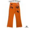 6931a3c9ccd8ab3d7af98063 Chrome Hearts & Croc Heart Art Basel Orange Flared Jeans with Cross Design