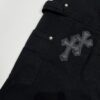 6931a3ebccd8ab3d7af982d3 Chrome Hearts CH Cross Embellished Patchwork Leather Logging Jeans