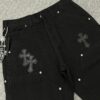 6931a3ebccd8ab3d7af982d7 Chrome Hearts CH Cross Embellished Patchwork Leather Logging Jeans