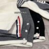 6931a51cccd8ab3d7af996a8 Thom Browne Color-Blocked V-Neck Knit Cardigan with Signature Tape and Classic Pocket, Mid-Length