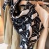 6931a902ccd8ab3d7af9d689 Chanel Rare Knit Cashmere Scarf in Soft, Elegant Colorway – A Timeless, Luxurious Statement Piece