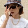 6931a9d0ccd8ab3d7af9e35e Balenciaga Black and Gold Sunglasses, Lightweight Retro Cat-Eye Frame with Double B Logo