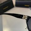 6931a9d2ccd8ab3d7af9e378 Balenciaga Black and Gold Aviator Sunglasses – The Celebrity-Inspired Look Everyone's Raving About