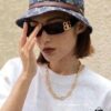 6931a9d3ccd8ab3d7af9e38b Balenciaga Black-Gold Aviator Sunglasses with Double B Logo