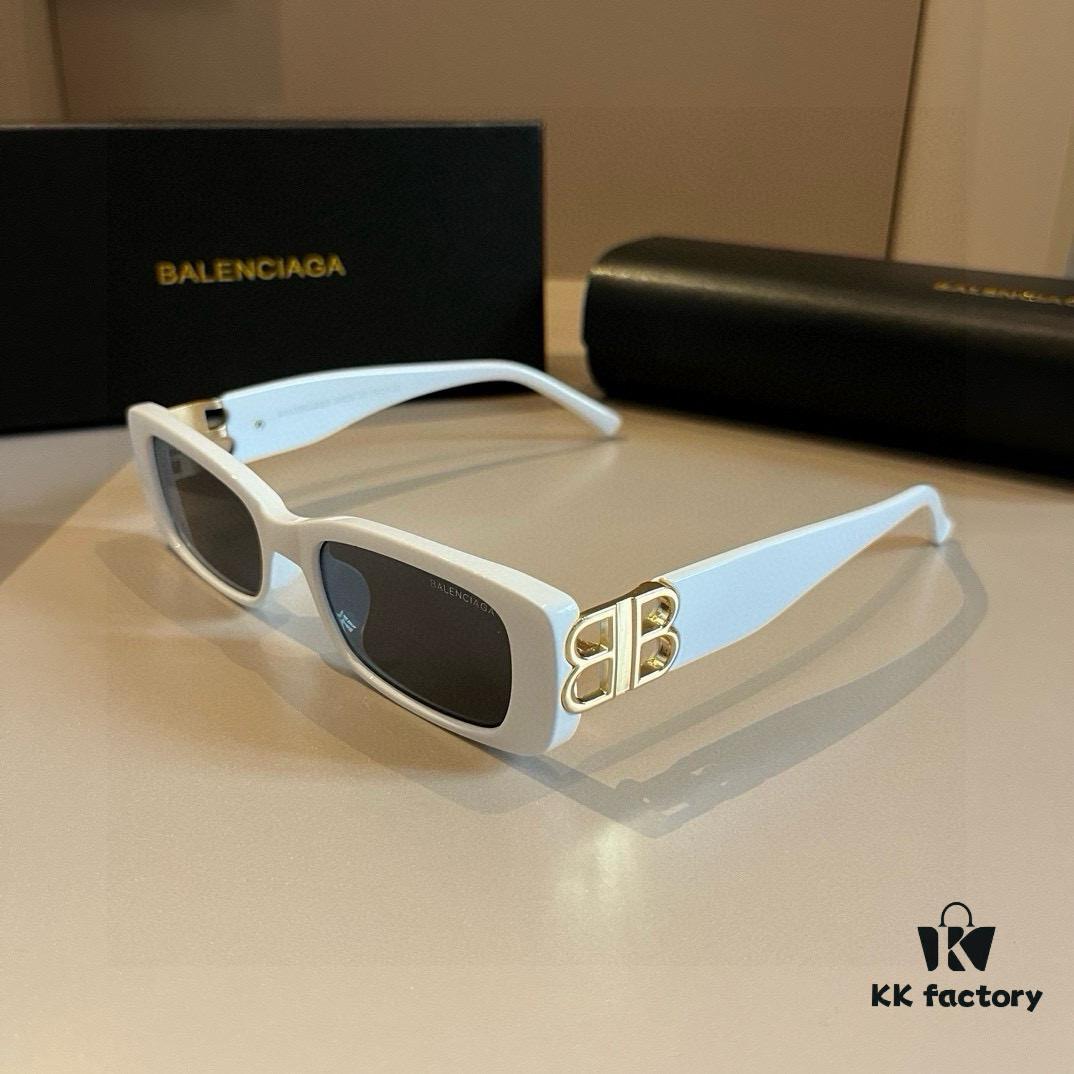 6931a9d4ccd8ab3d7af9e395 Balenciaga Black and Gold Sunglasses with Double B Logo