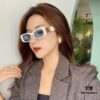 6931a9d7ccd8ab3d7af9e3c5 Balenciaga Black and Gold Sunglasses with Double B Logo, Retro Lightweight Frame