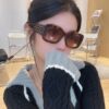 CHANEL New Classic Black and White Sunglasses with Logo-Embellished Temples