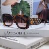 CHANEL New Classic Black and White Sunglasses with Logo-Embellished Temples